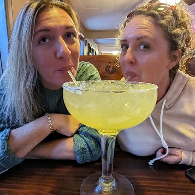 Sharing an oversized house margarita at Casa Sanchez Buena Vista