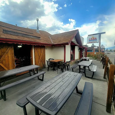 Picnic tables under the open barn doors on the Buena Vista patio