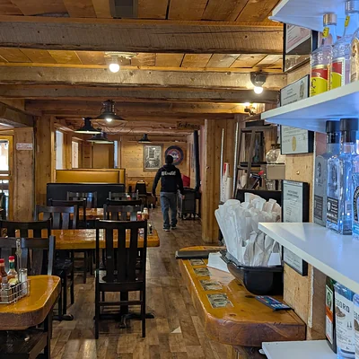 Timber dining room and tequila shelf at Casa Sanchez Fairplay