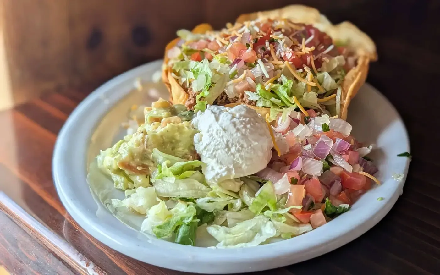 Taco salad with guacamole, sour cream, and pico de gallo